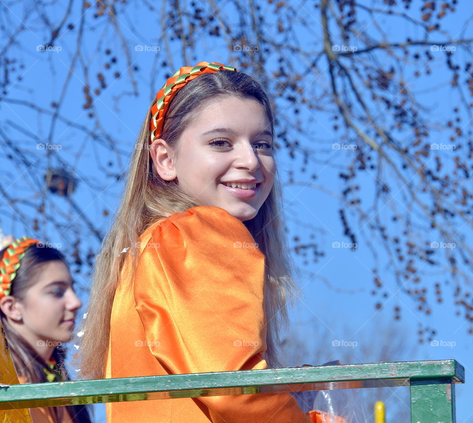 a smiling girl. carnival parade