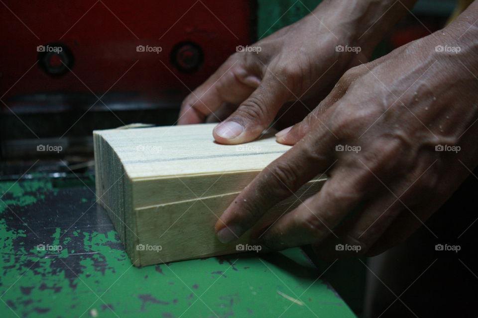 Close-up of a person holding wood