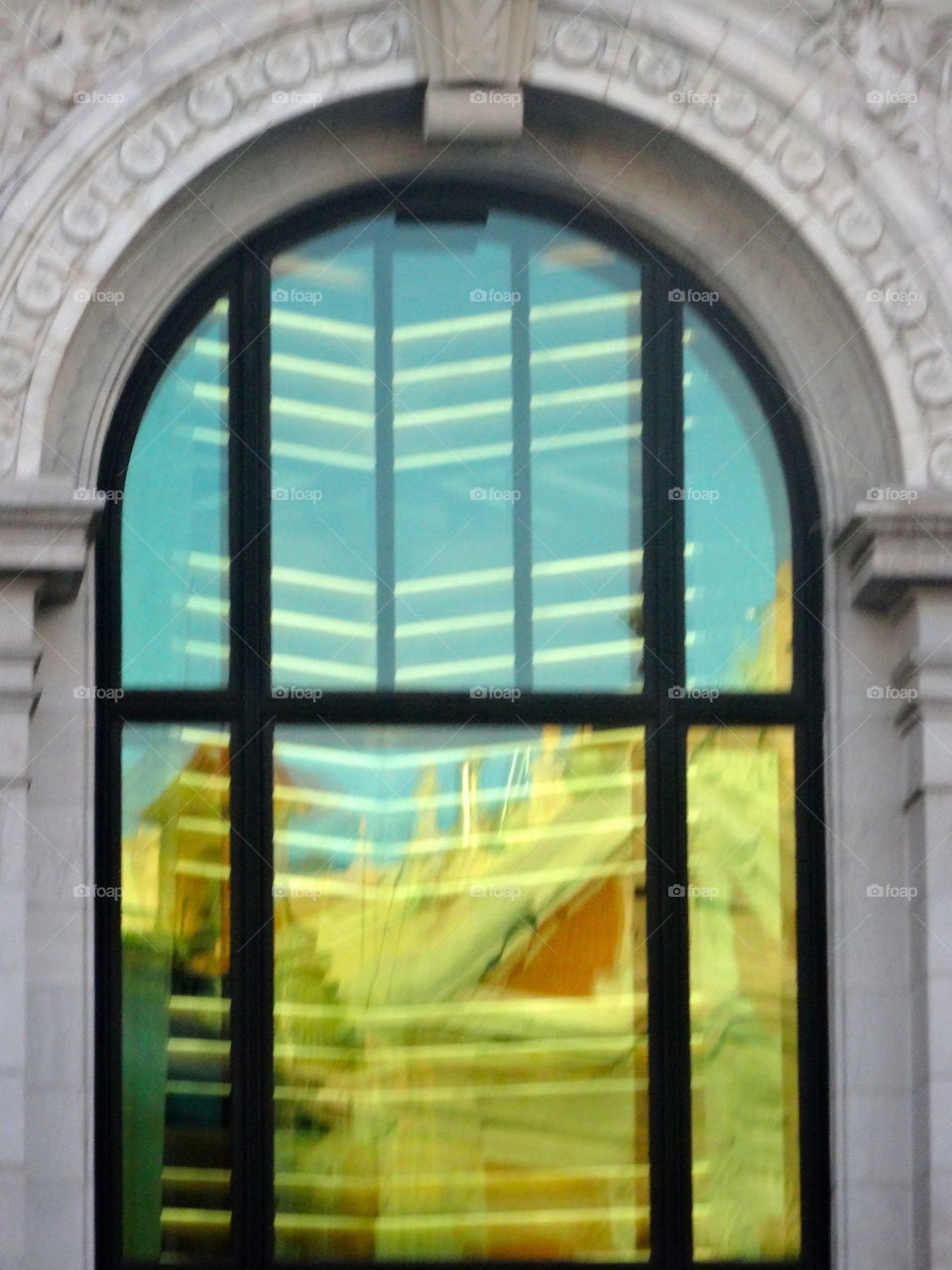 reflection on an old building in Madrid