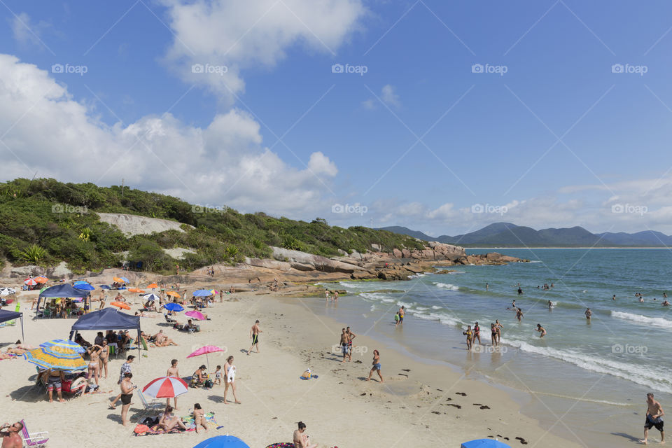 Tourists enjoy the summer on the little beach in Barra da Lagoa in Florianopolis Santa Catarina Brazil.