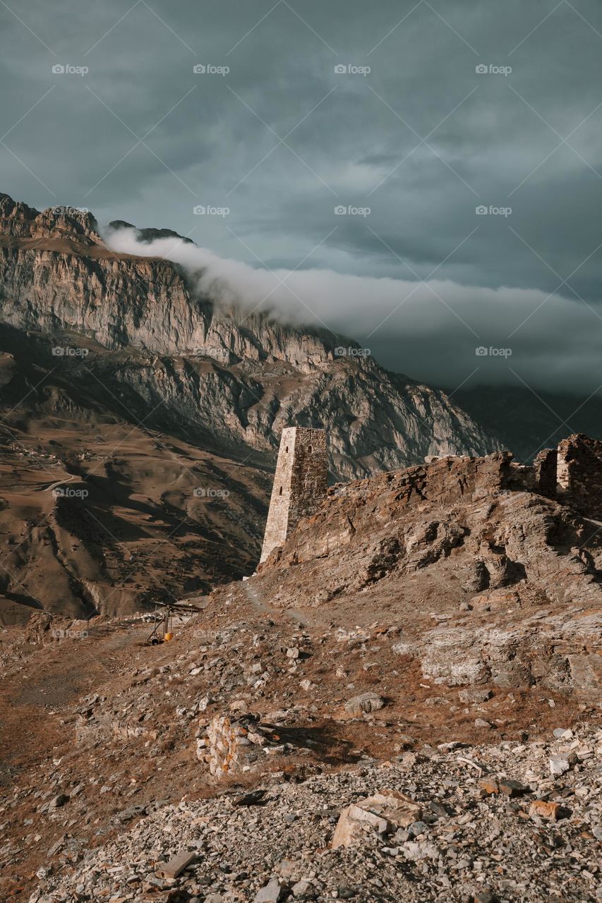 Ancient stone tower in mountains