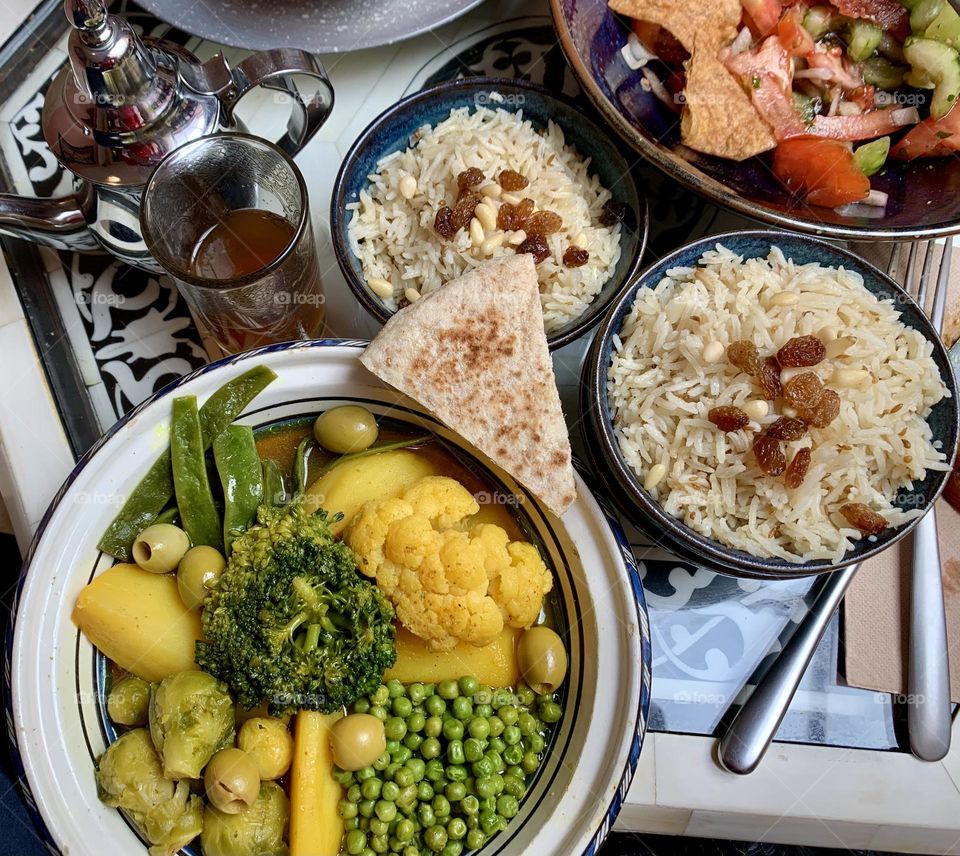 Typical Arabic meal, vegetable tajine, rice, fattouche salad 