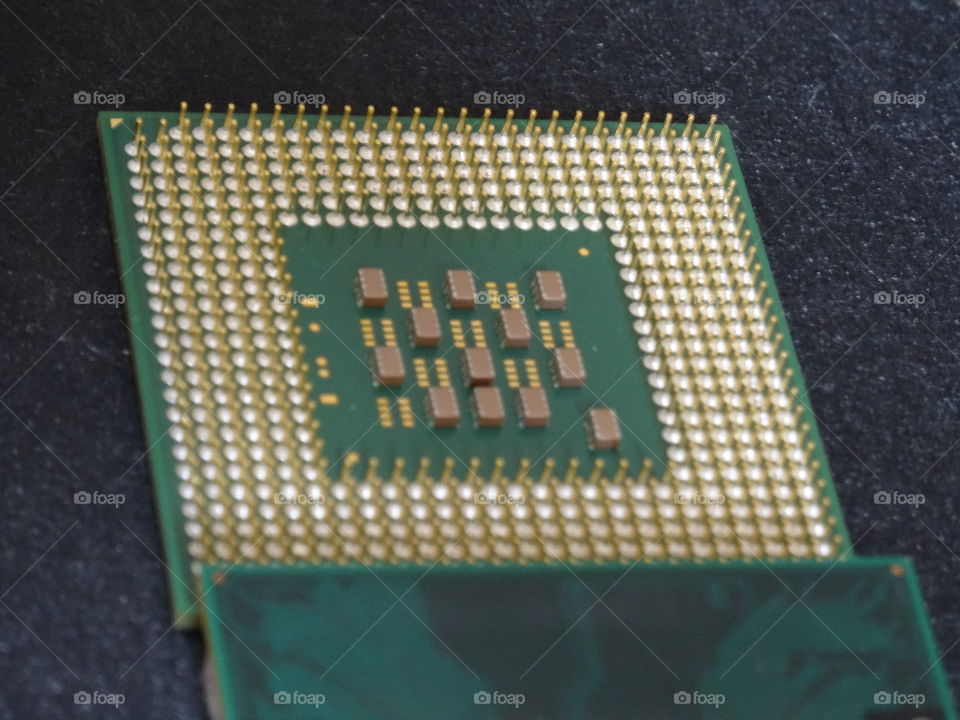 CPU an pin contacts - modern technology shooted from angle view