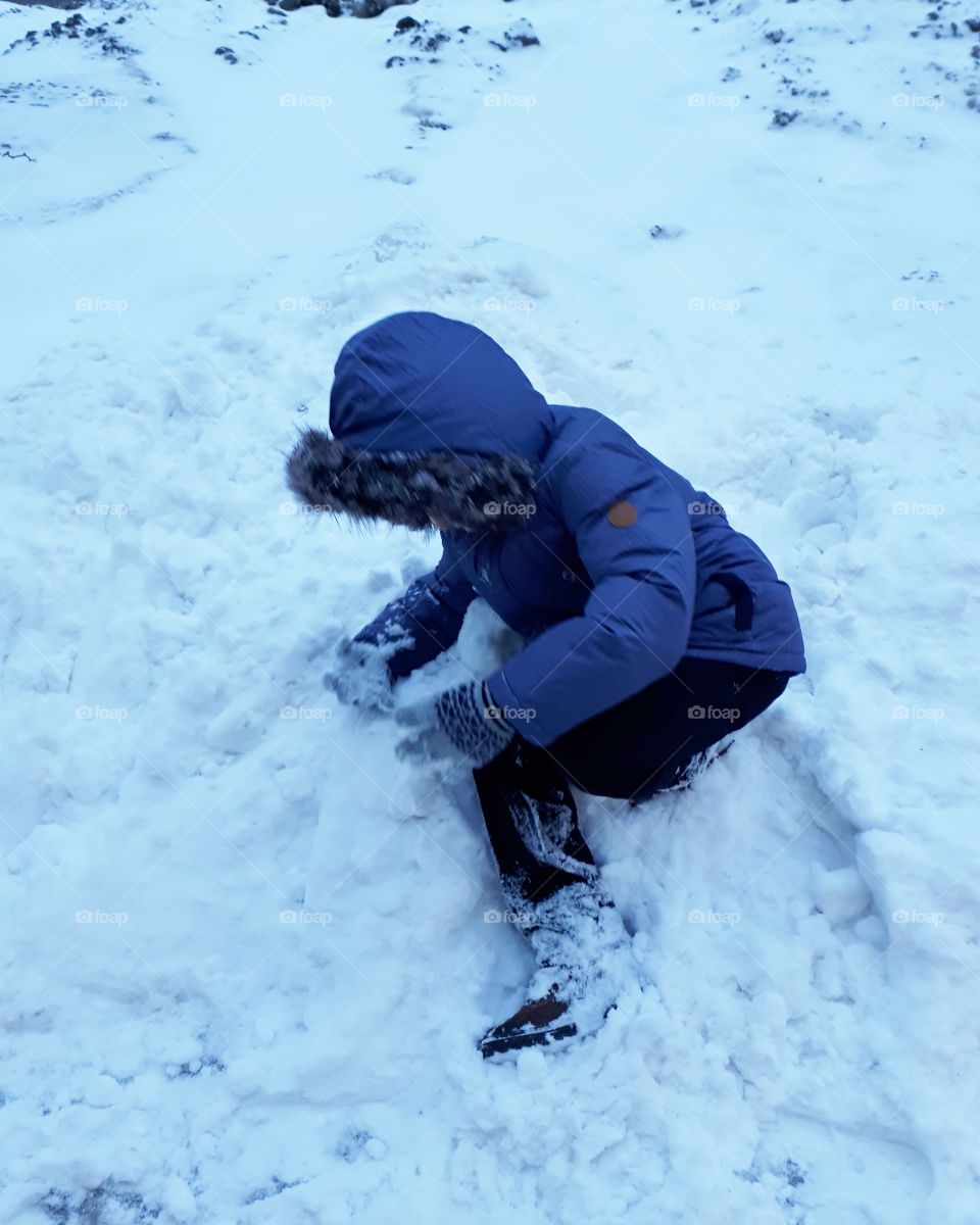 Boy playing in the snow