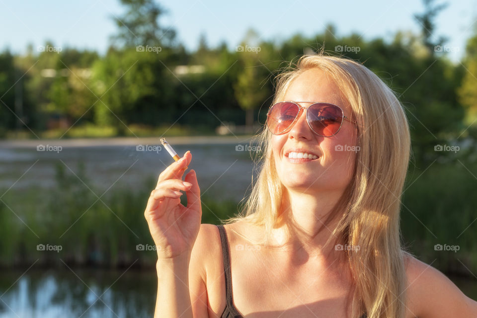 Cool woman smoke a cigarette