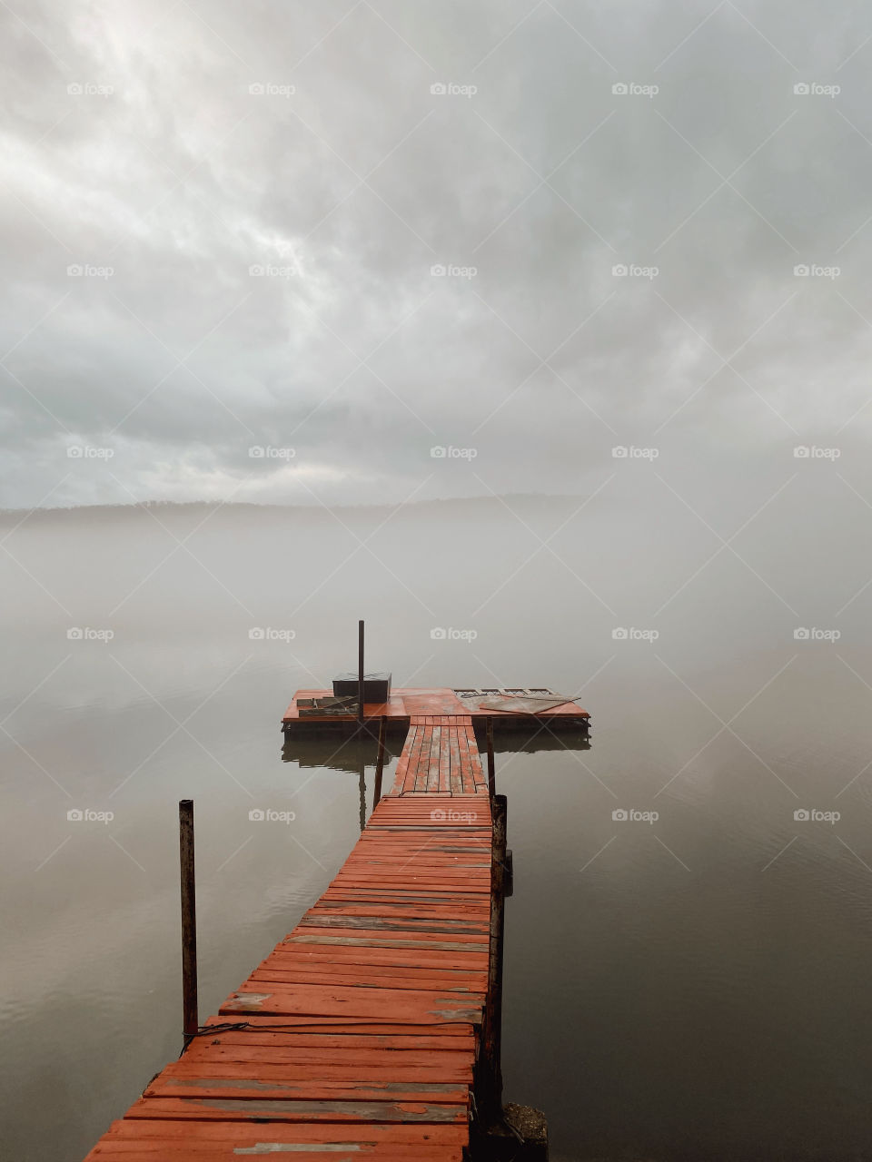 Fog on dock on lake