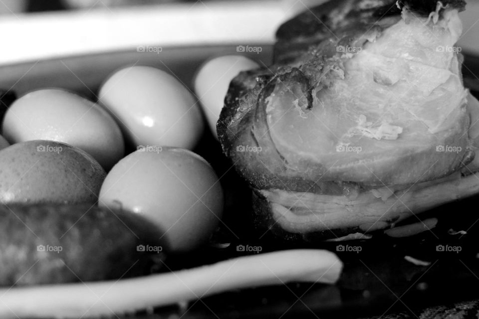 The traditional Easter dish in Hungary: home-made smoked ham, hard-boiled eggs and green onions