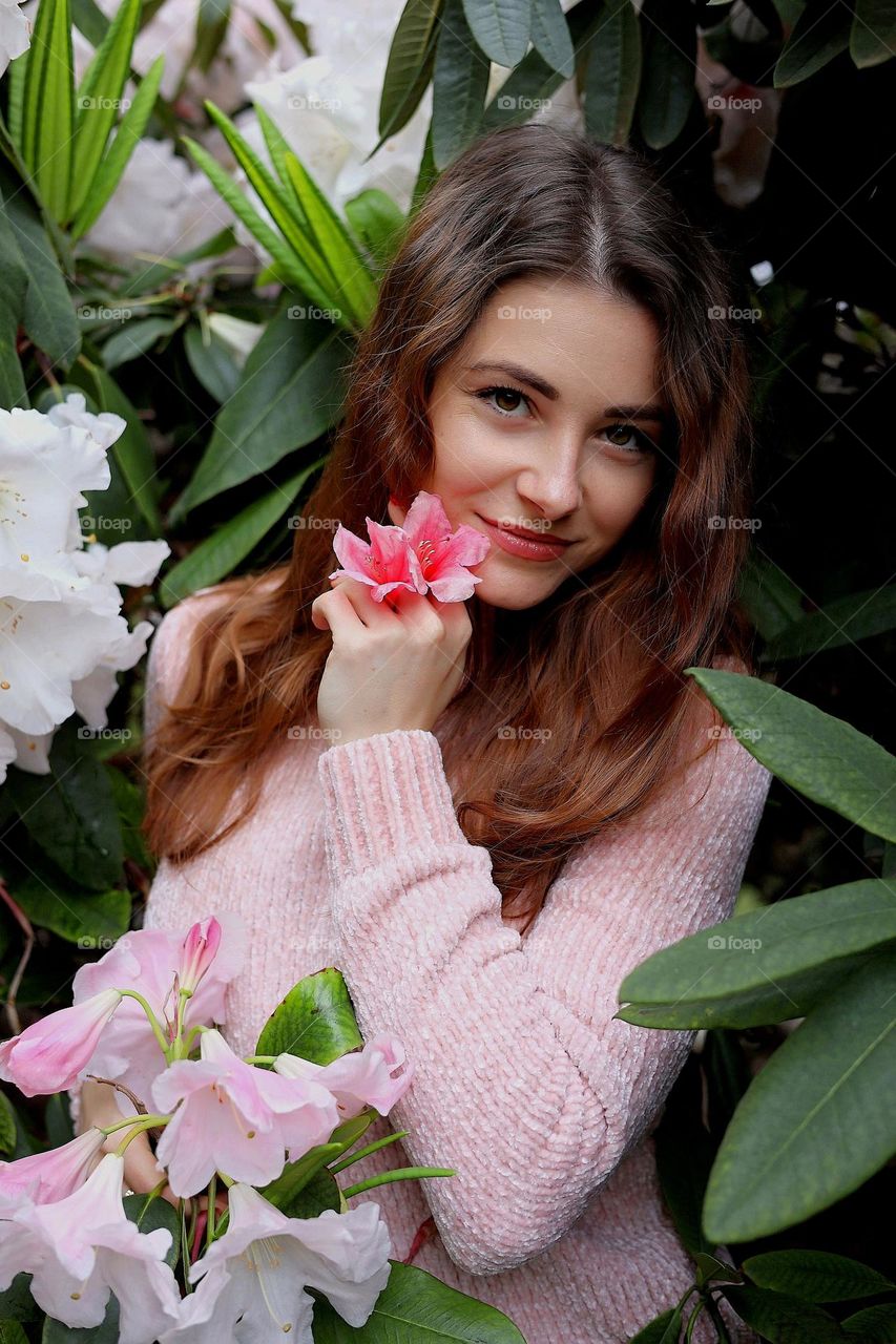 Beautiful young lady portrait. Natural beauty. Woman with flowers.