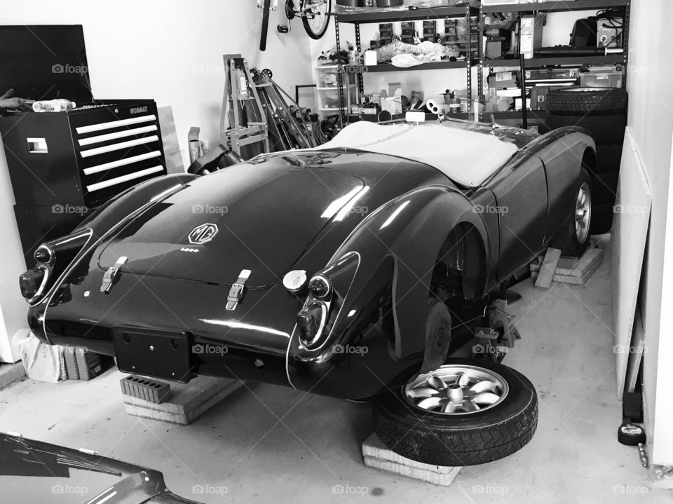 Working on car in garage classic 1960 mga