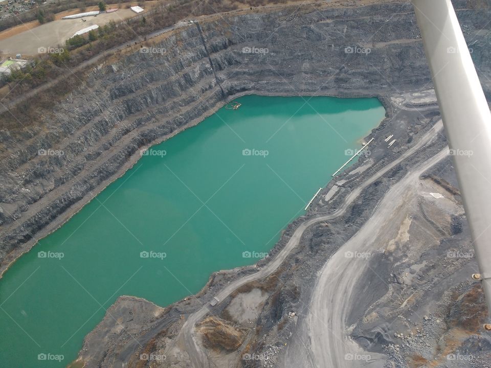 a quarry seen out the window of a Cessna 172