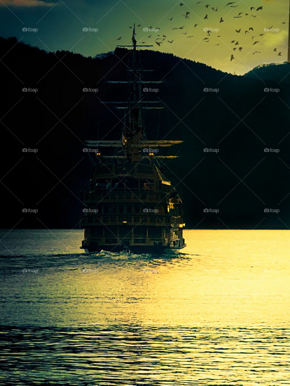 amazing golden evening in ocean with ship