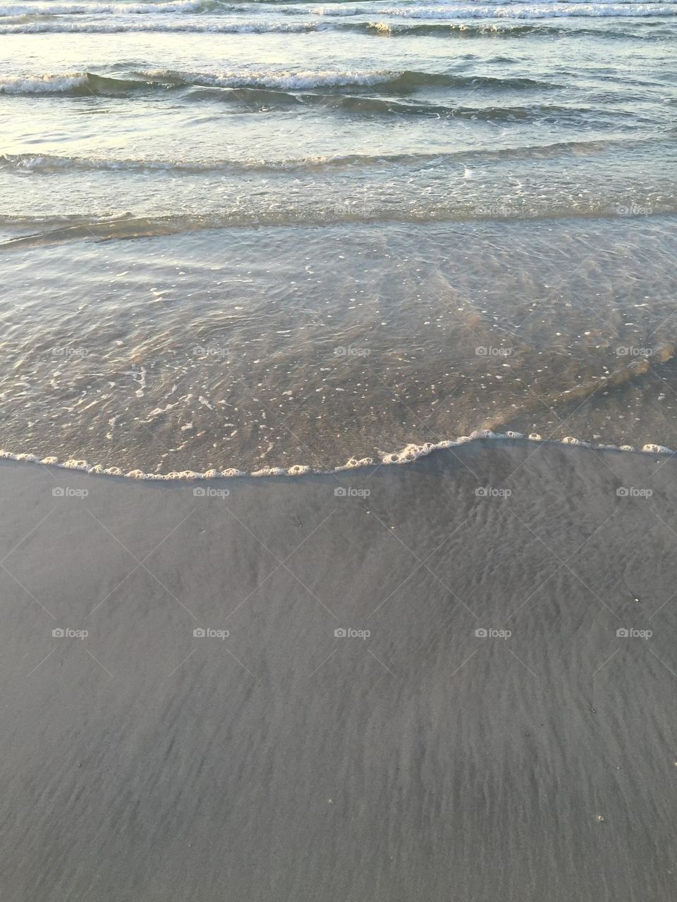 A calm break of the shore on a simple lake in the desert 