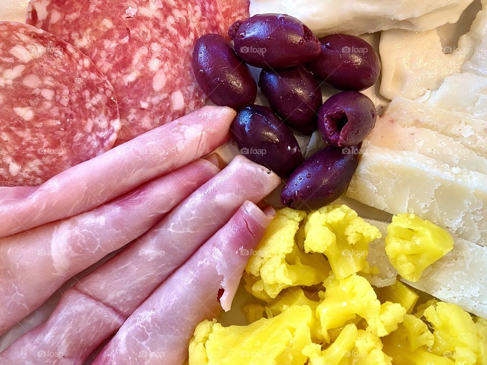 Snack time meat, cheese, olive, and vegetable platter