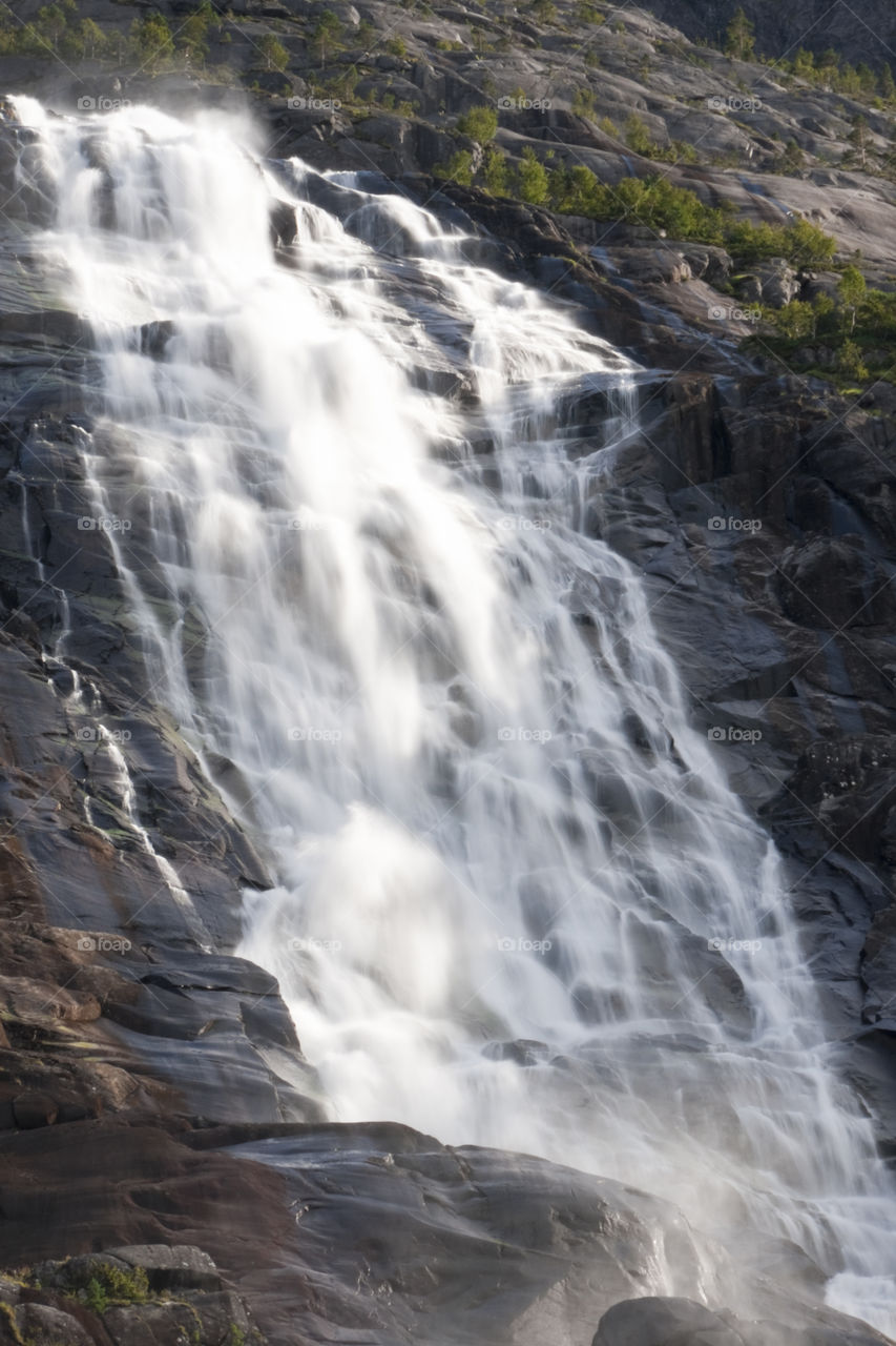 Langfossen is a waterfall located in the municipality of Etne in western Norway.
The total fall is around 600 meters, where it leaps out into Åkrafjorden.