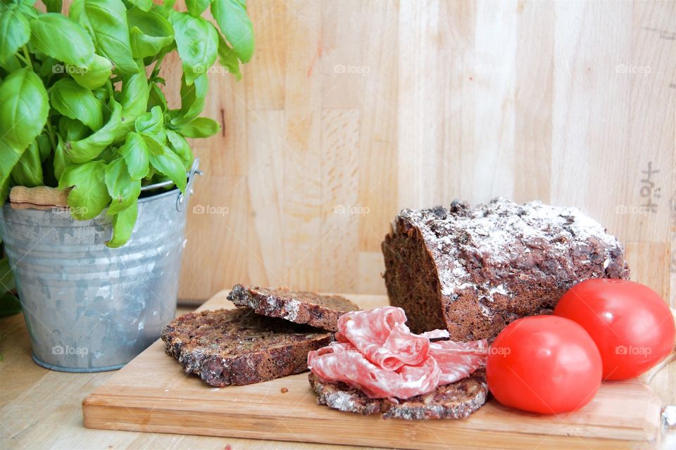 Close-up of cake and tomato with sausage