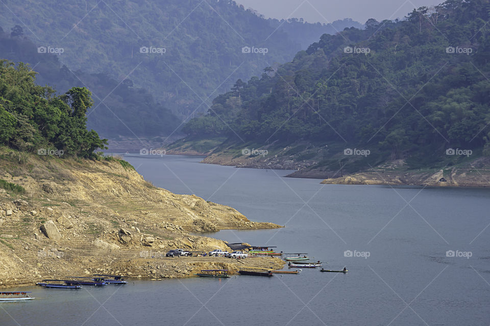 The tourist boat pier park on water at Khun Dan Prakan Chon Dam