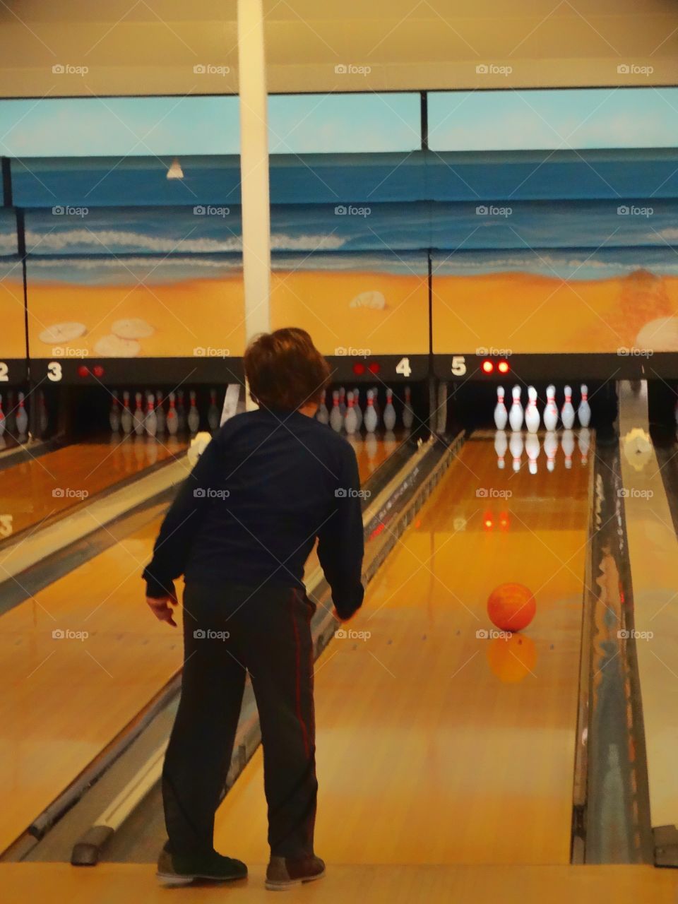 Boy In Bowling Alley