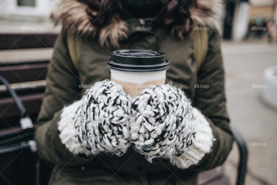 drinking coffee outdoors in winter / mittens / winter beverage 