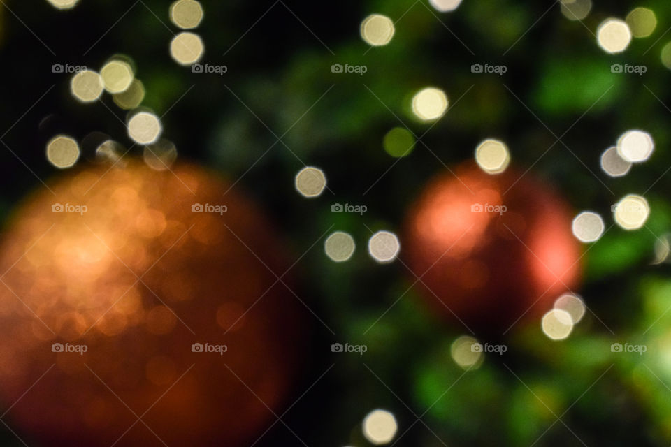 Bokeh and Blurred Christmas Tree and Red Christmas Ball