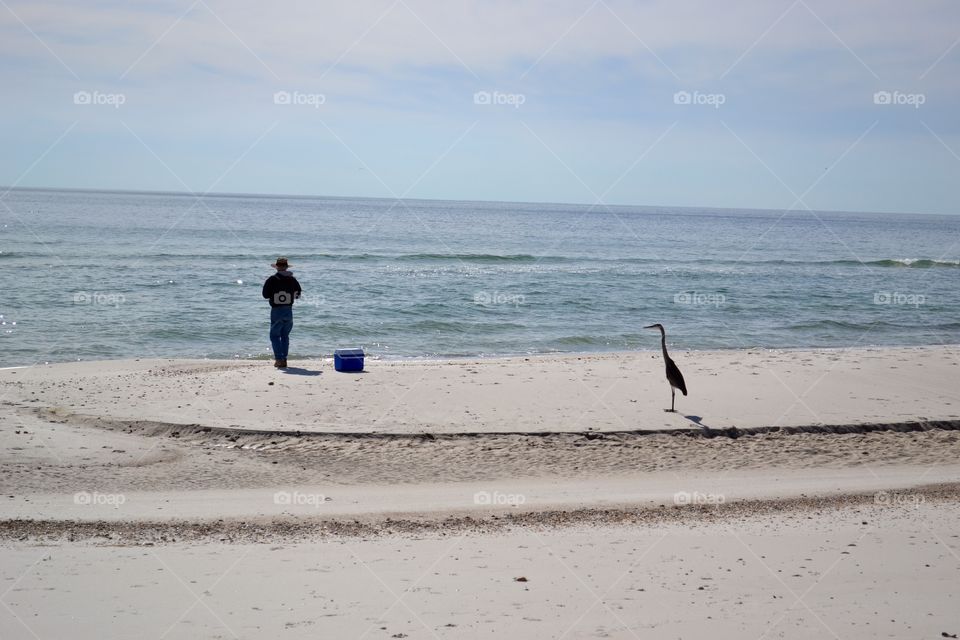 Two Fishermen On The Beach
