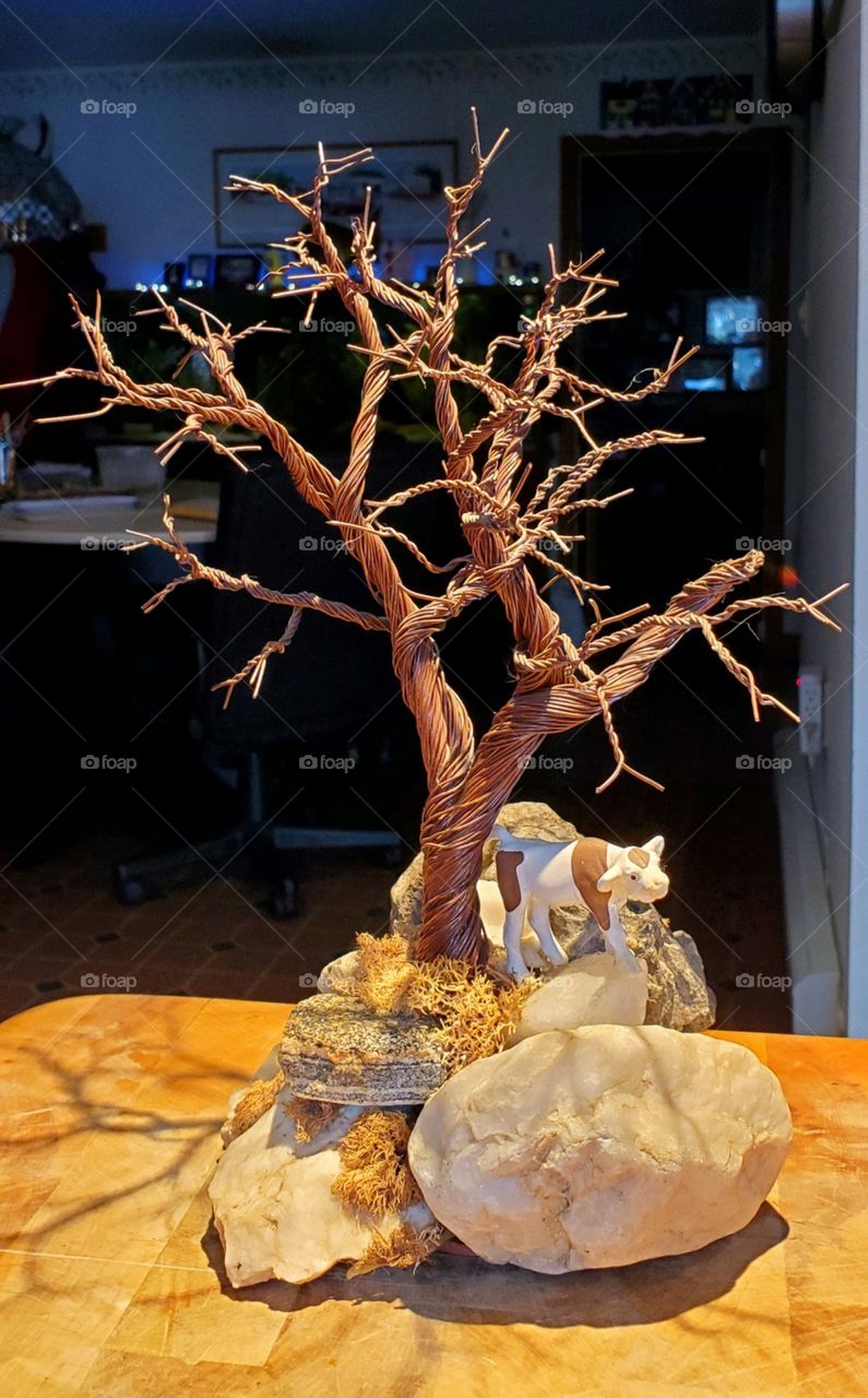 Handmade tree using thin copper wire, delicately twisted into a bonsai & displayed on rocks. This was painted brown by the artist, each is an original piece of art.