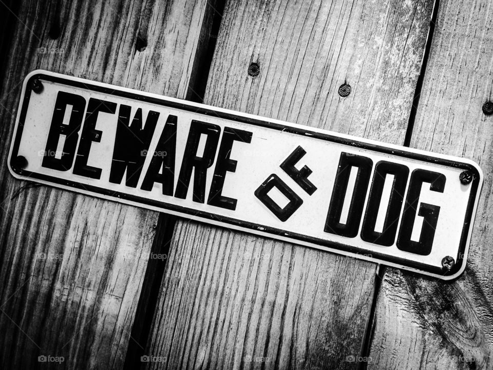 Beware of Dog. The sign says it all, so heed it well. 