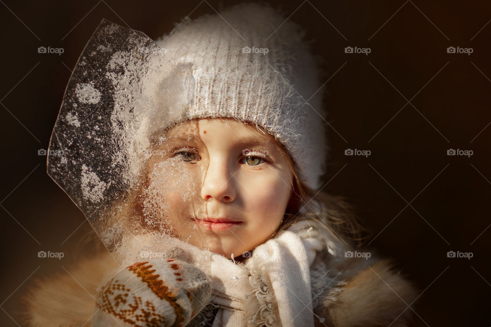Little girl portrait with ice