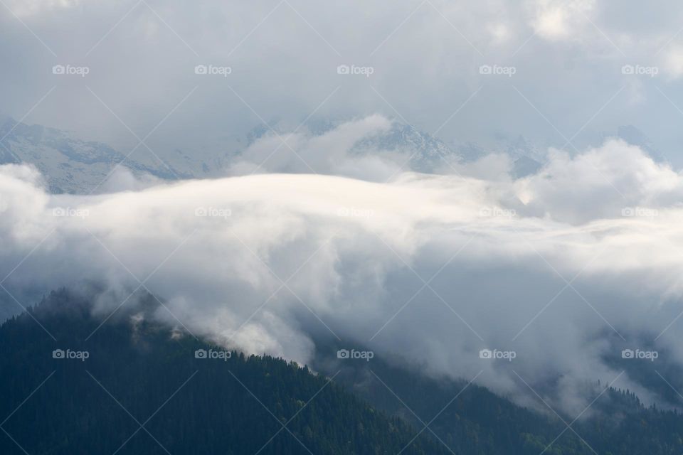 View of the cloud covered Caucasus mountains from Heshkili, Mestia in Georgia on October 6, 2022.