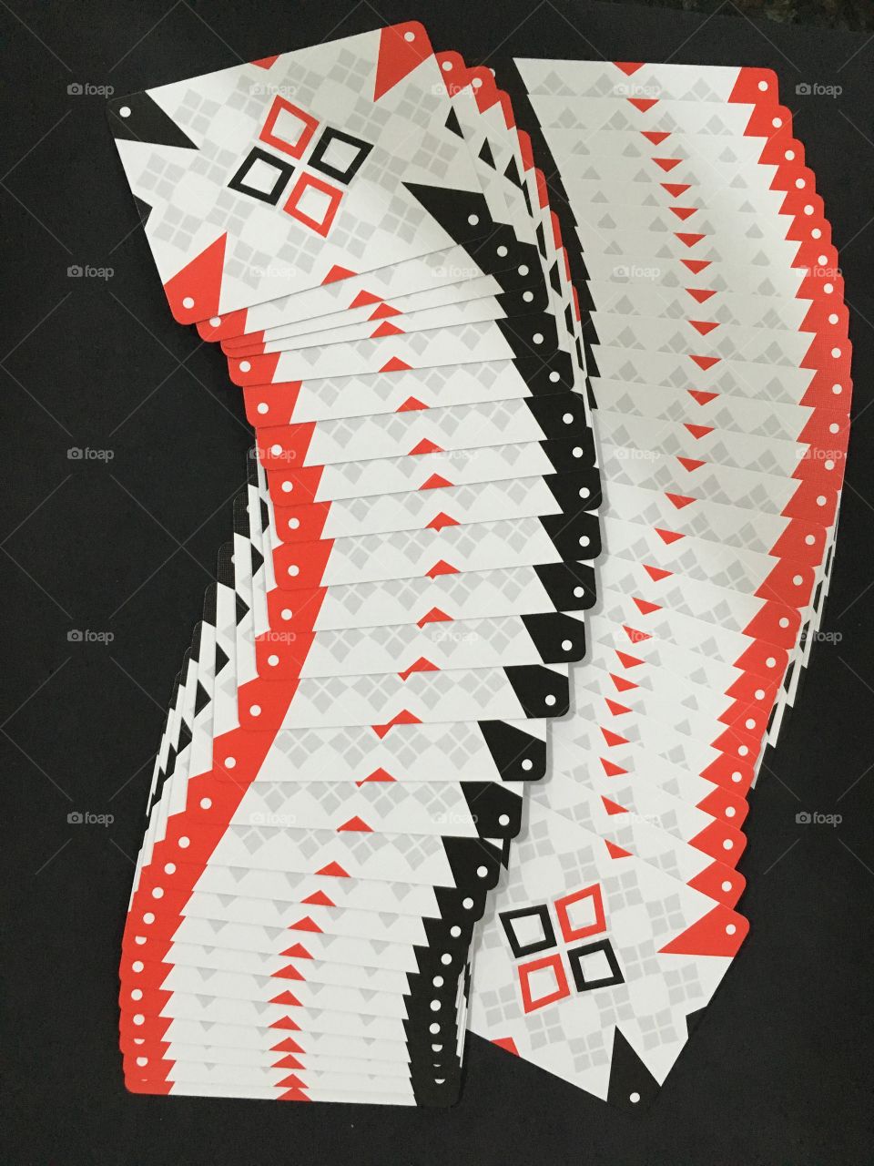 Arrangement of playing cards on black background