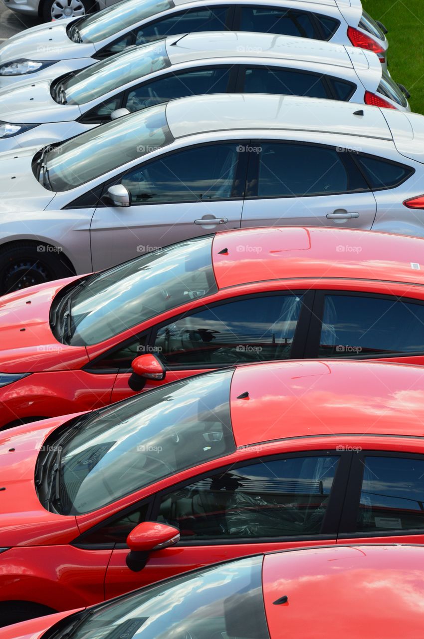 Red and gray cars in a row