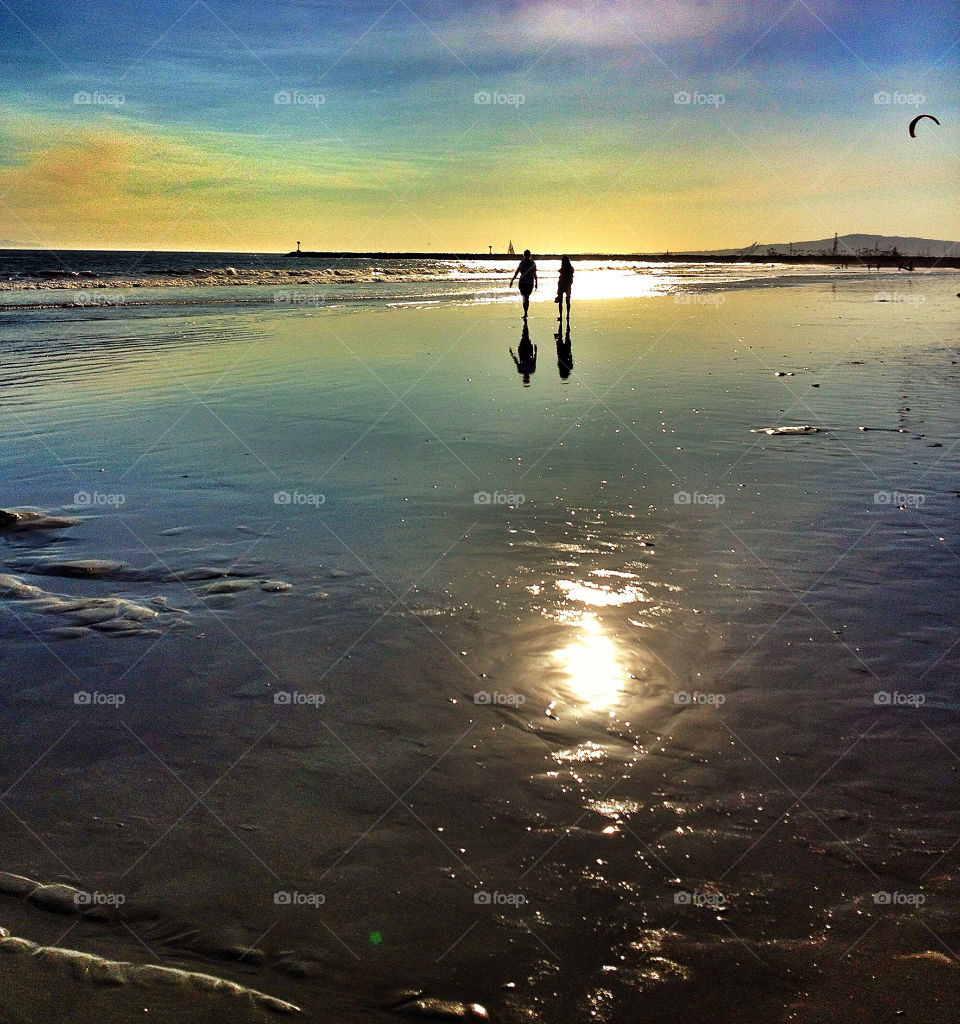 beach people sunset water by analia