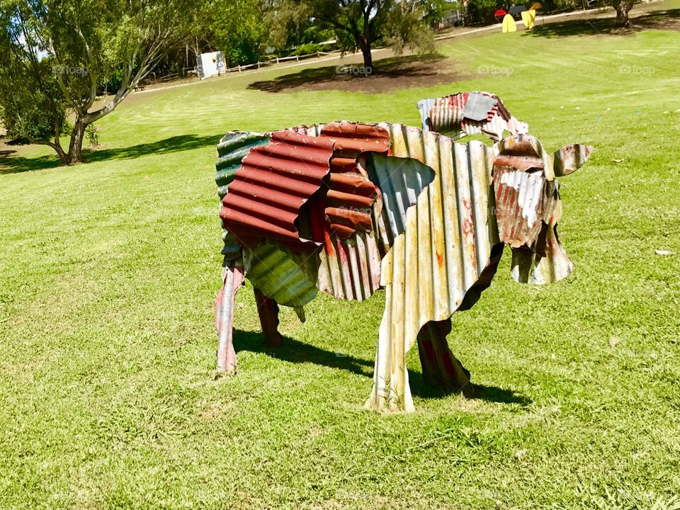 Sculpture cow in the field