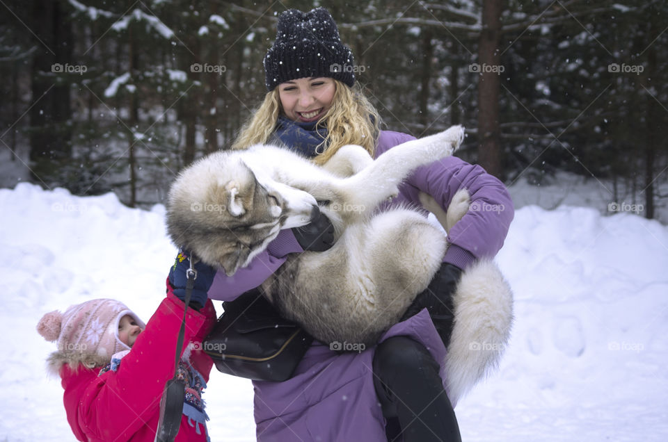 mother with daughter and dog husky