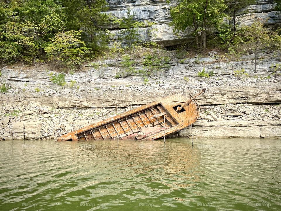 Old abandoned boat that is usually underwater until the lake levels are lowered for winter 