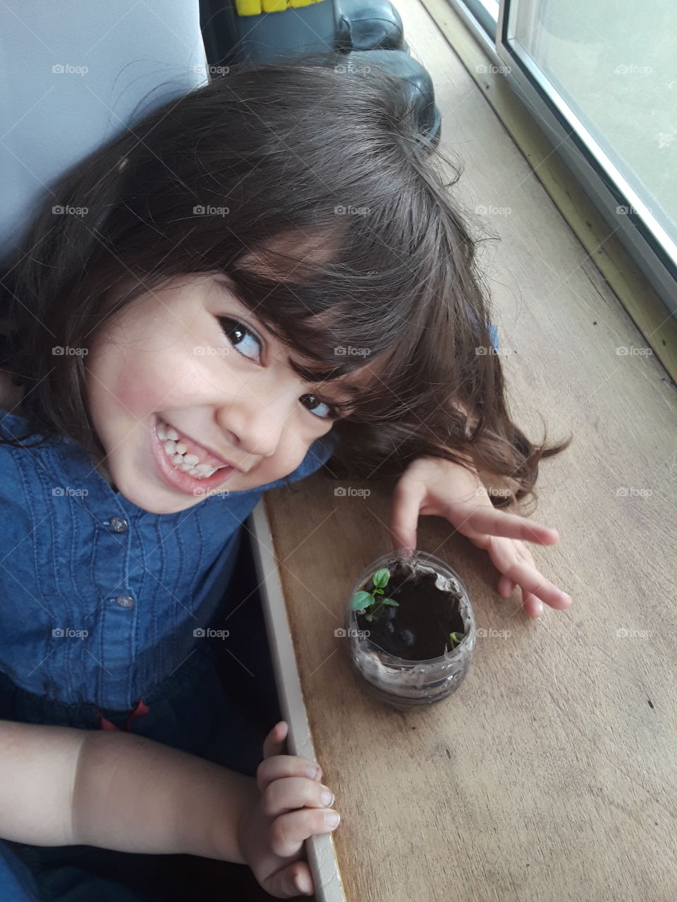 Toddler learning about plant growth.