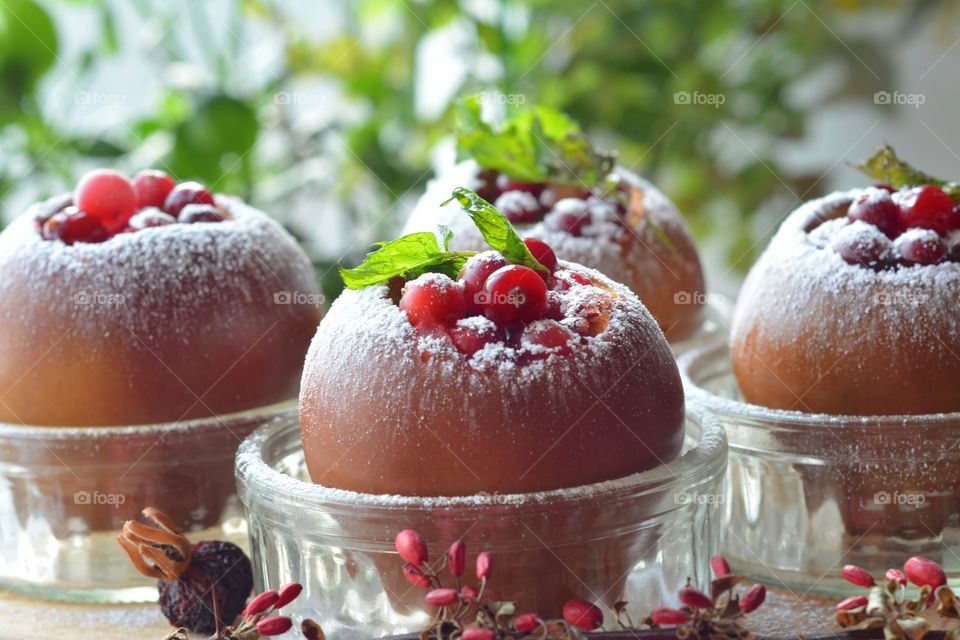 Baked apples in glass bowl