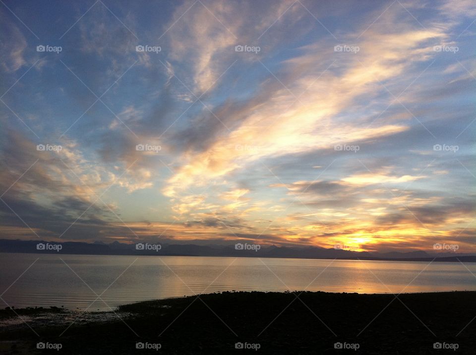 Sunrise greeting the ocean across the mountains. 