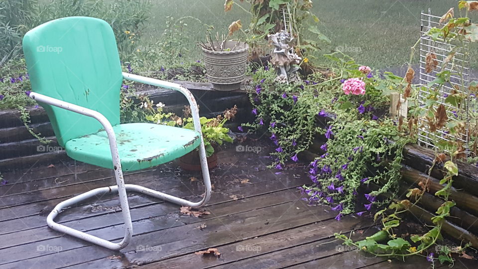 Vintage green lawn chair on the deck