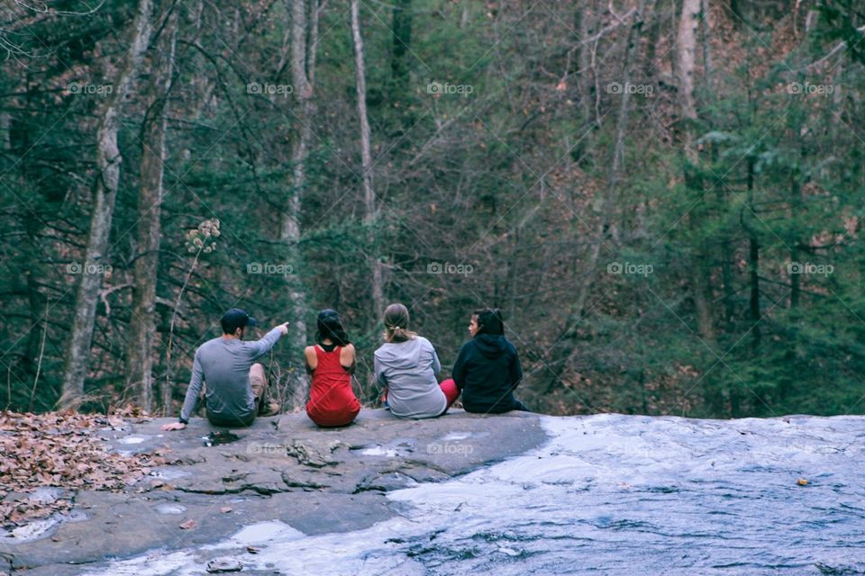Friend group on a waterfall 