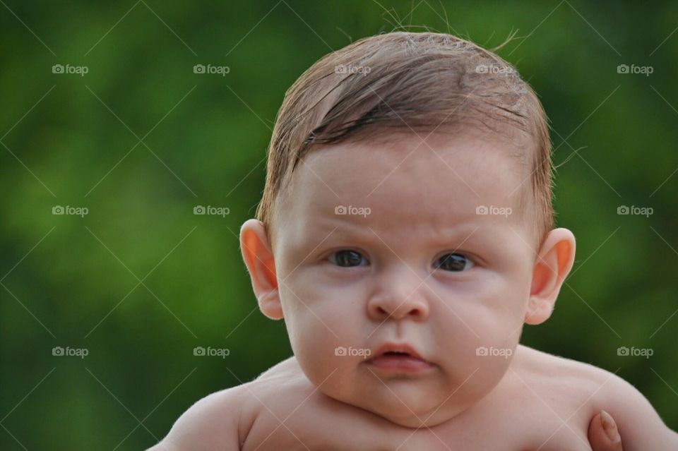 Portrait of cute baby boy looking at camera
