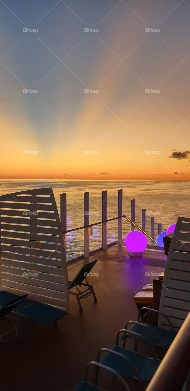 sunset cruise ship carribean clouds