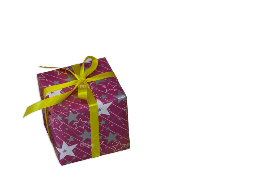 Isolated Gift box wrapped with a star pattern for the festivities on a white background with clipping path.