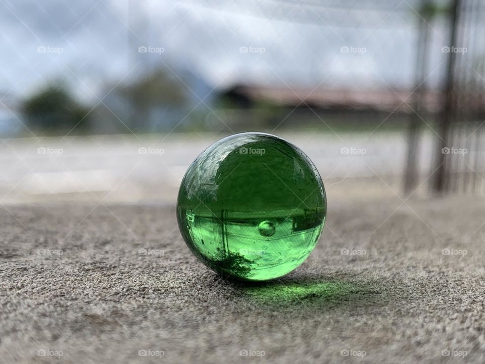 A marble is a small spherical object often made from glass, clay, steel, plastic, or agate. 