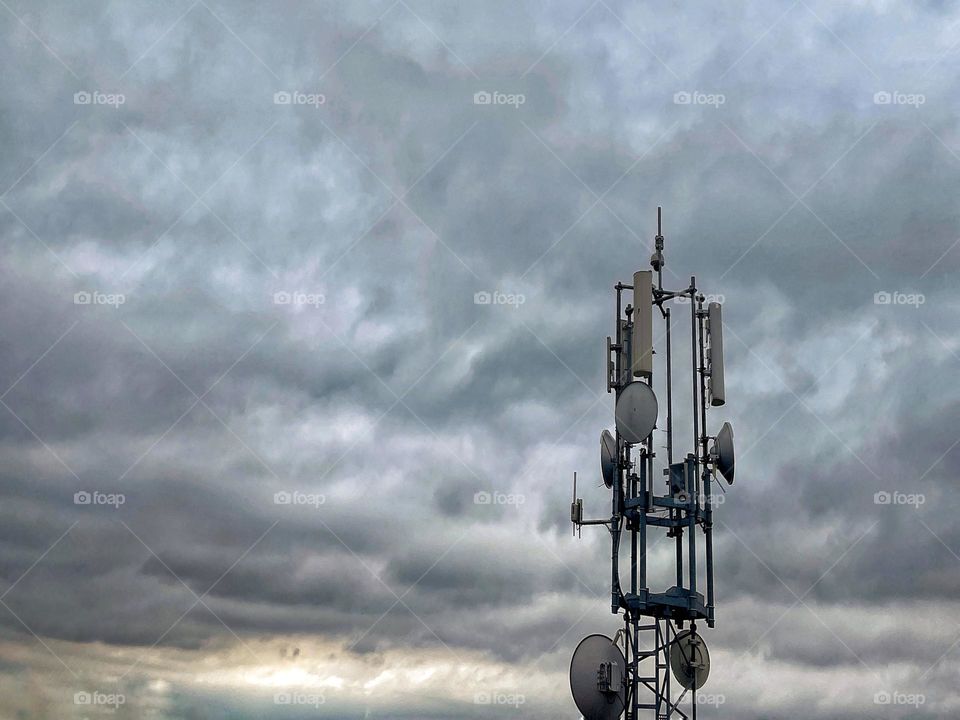 Close up of a transmission tower against dramatic sky
