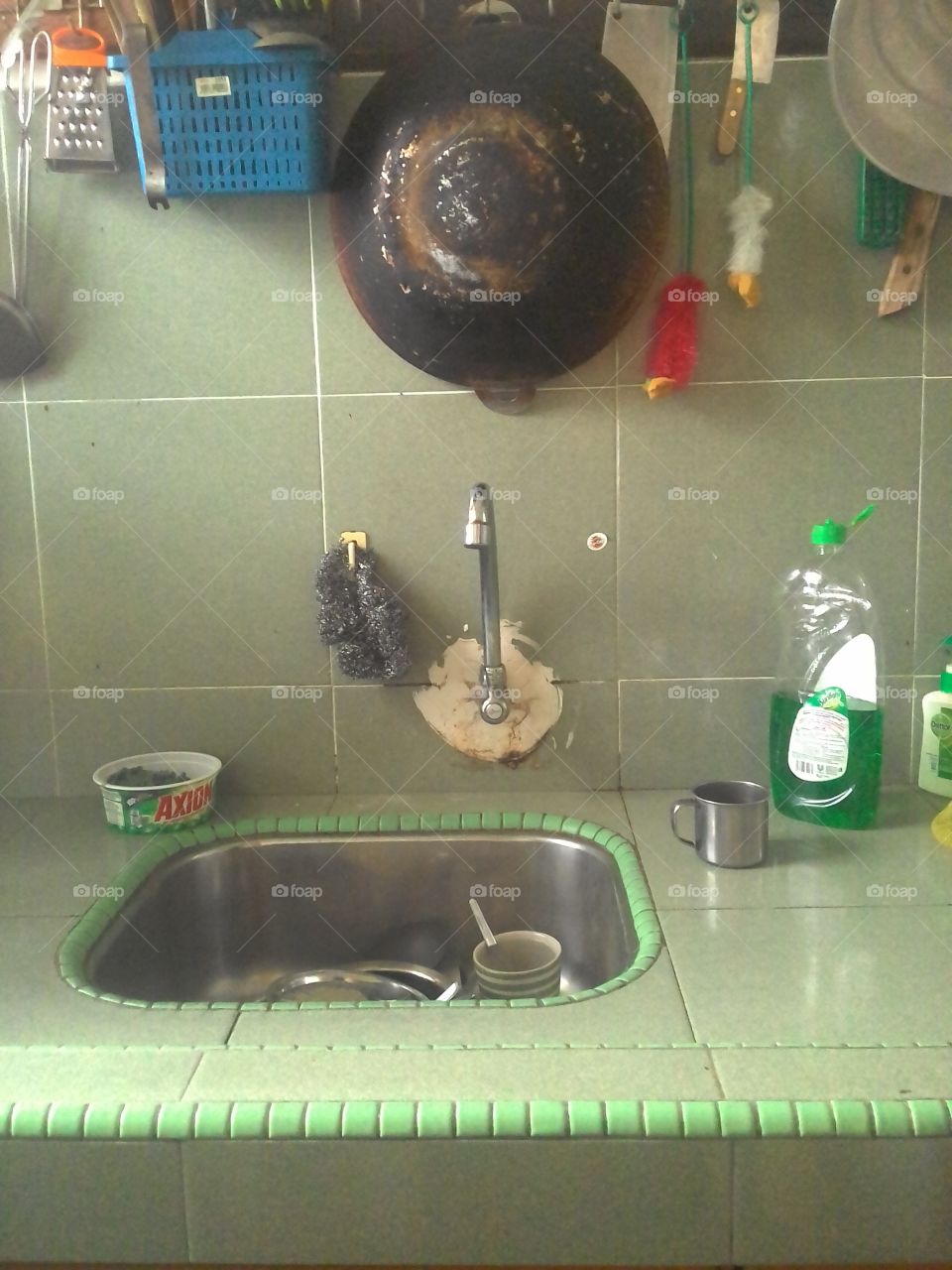 Typical Asian Kitchen Sink.

The candid shot depicts typical design of Asian kitchen sink in common household; showing the everyday household structure mothers need to face to get their job done.