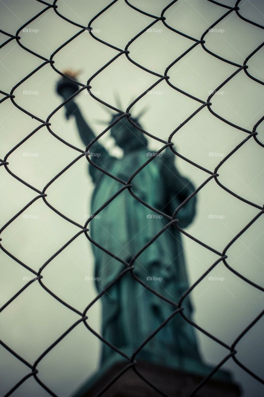 Caged statue of Liberty 