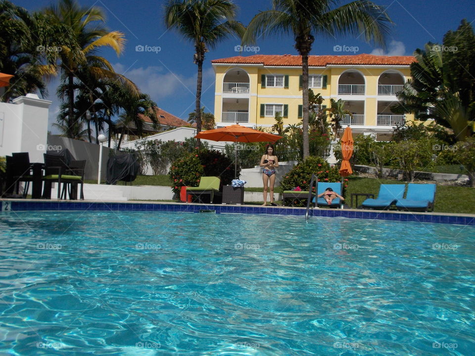 Poolside. Sunbathing 