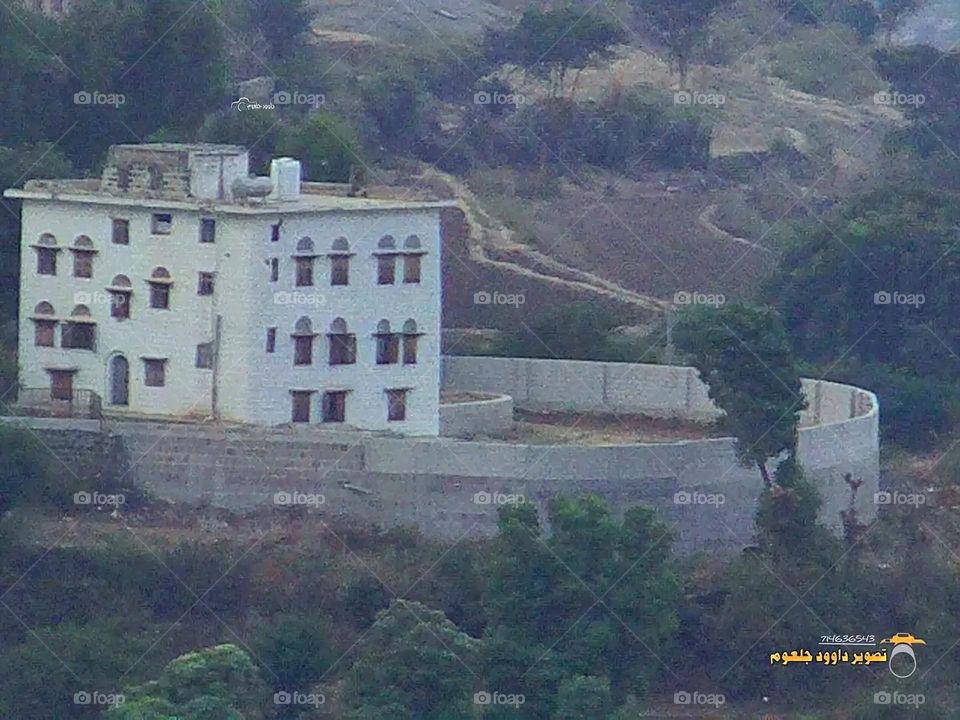 A stunning view of green mountains covered in fog in Yemen