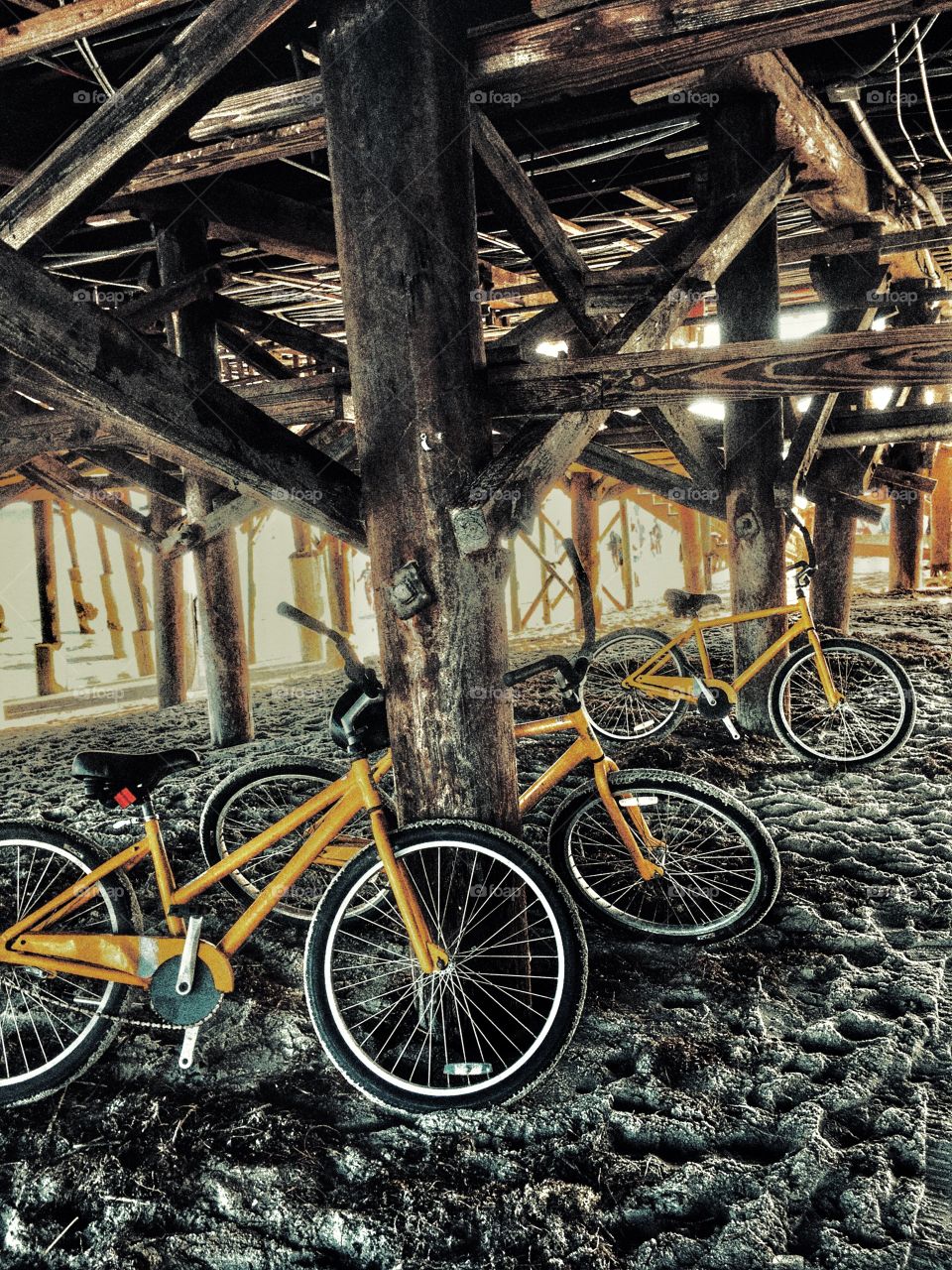 Bicycles parked under the bridge