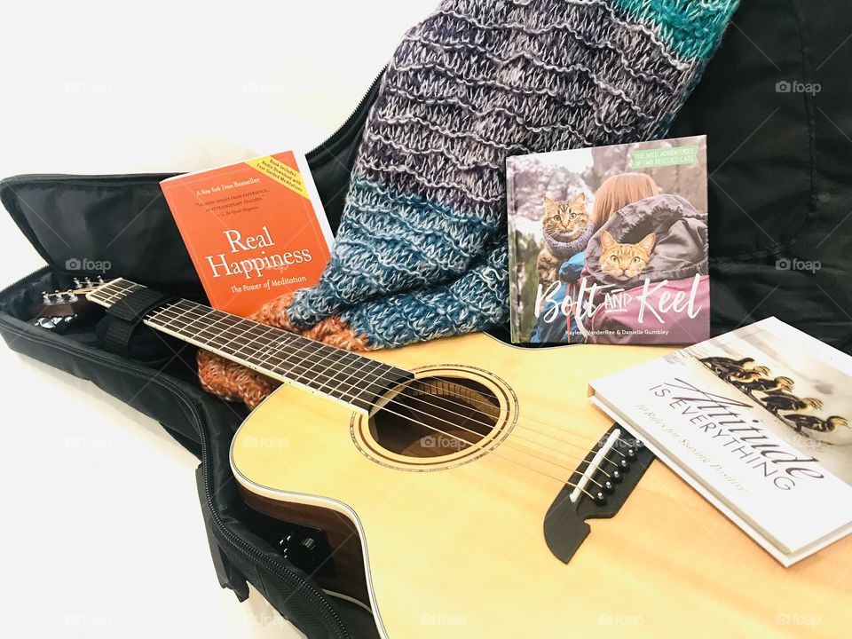 Let’s get ready to travel with best guitar, favorite feel good reads, a little cash, and best scarf! 